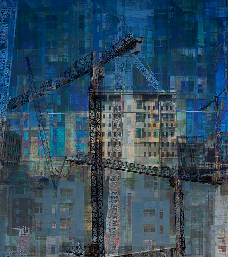 Tower cranes over a high-rise under construction in dark blue layered tones